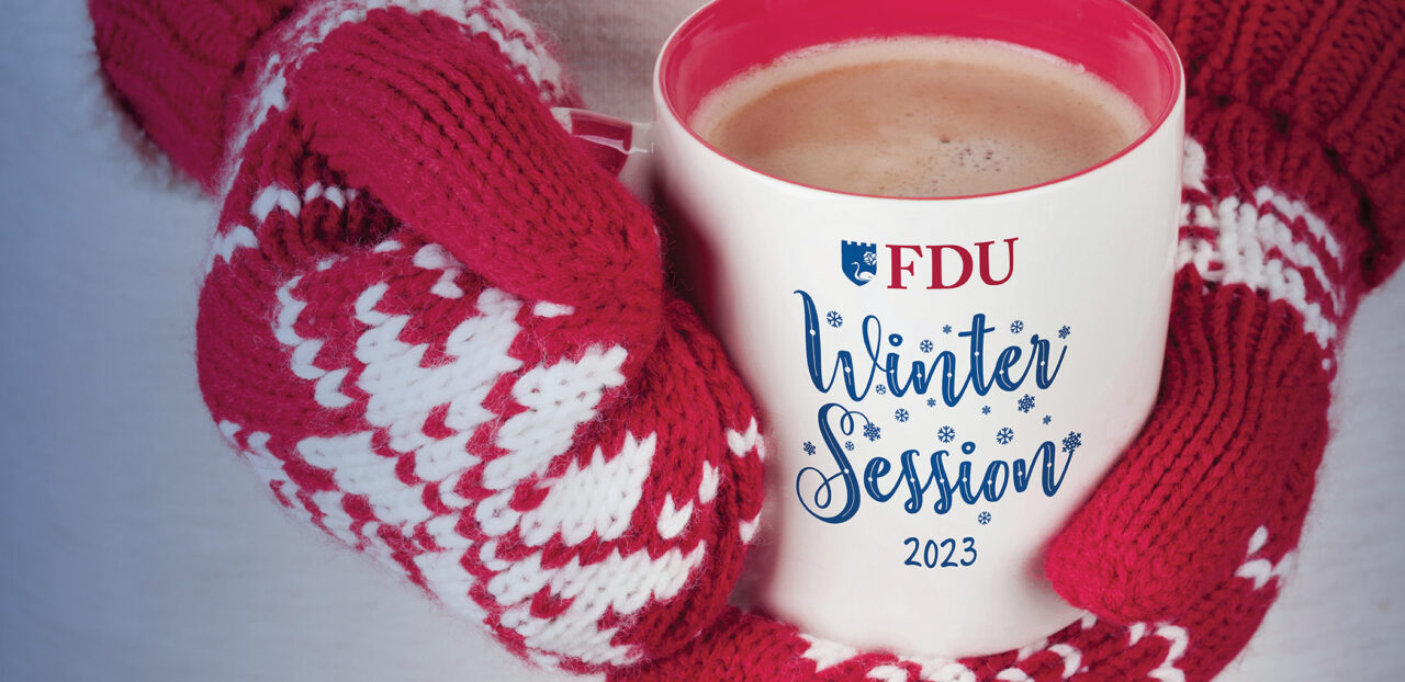 An image of two hands wearing red and white mittens holding a cup of hot chocolate. The cup has the FDU logo printed on it followed by the words "Winter Session 2023"