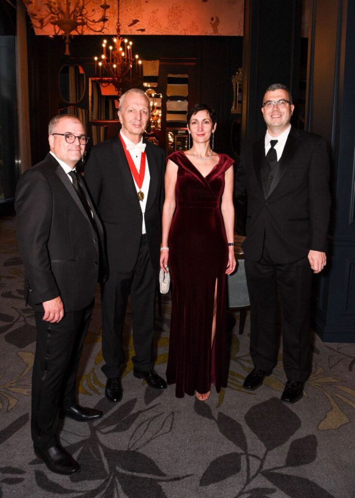 Formal group photo of Philip DeMaiolo, John and Oxana Niser, and Michael Avaltroni