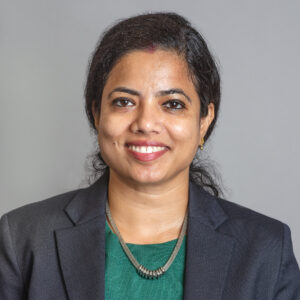 Portrait of a woman in a suit.