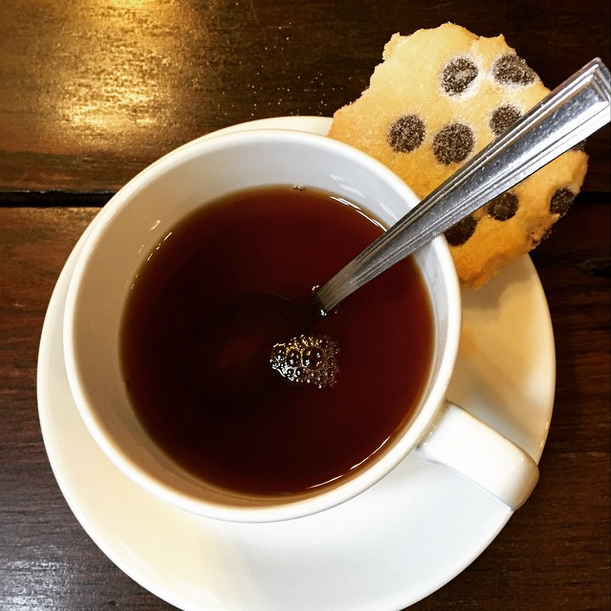 A cup of tea and a biscuit.