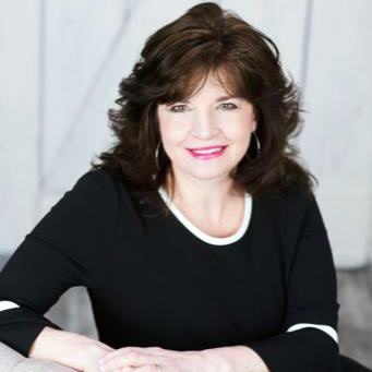 Portrait of a woman who is sitting.