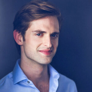 Headshot portrait of a male actor and professor.