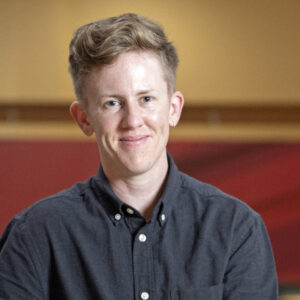 Portrait of a person wearing a button-down shirt.