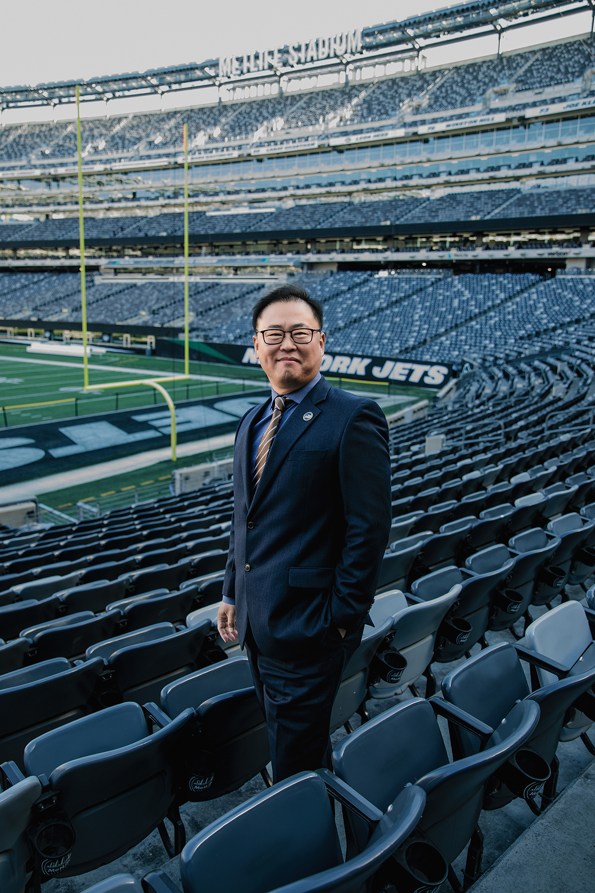 A man stands in the seats at MetLife Stadium.