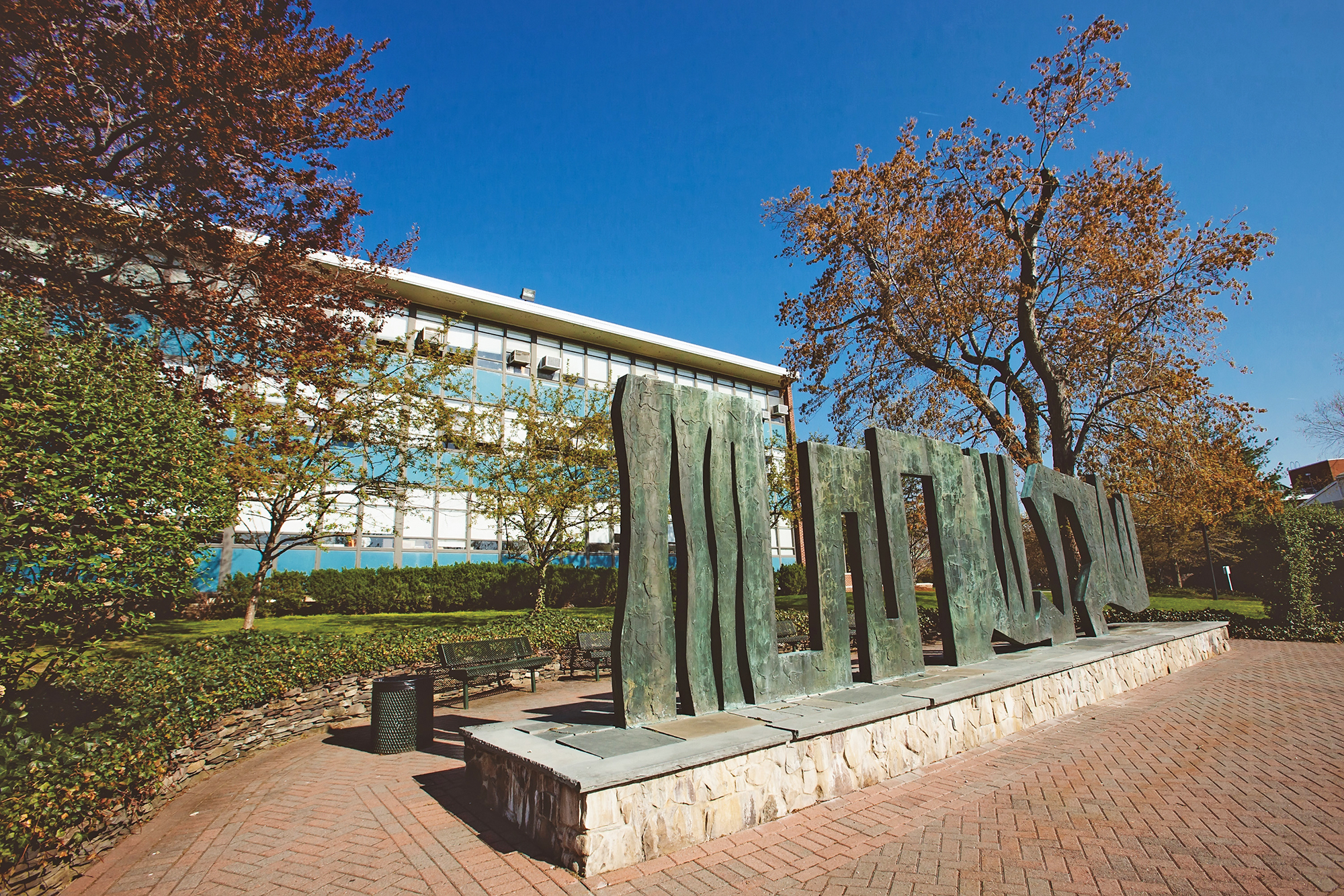 The Peace Screen statue on a sunny day with a blue sky.