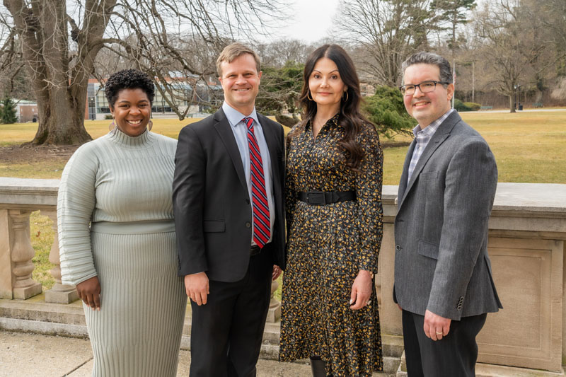 Four people standing together