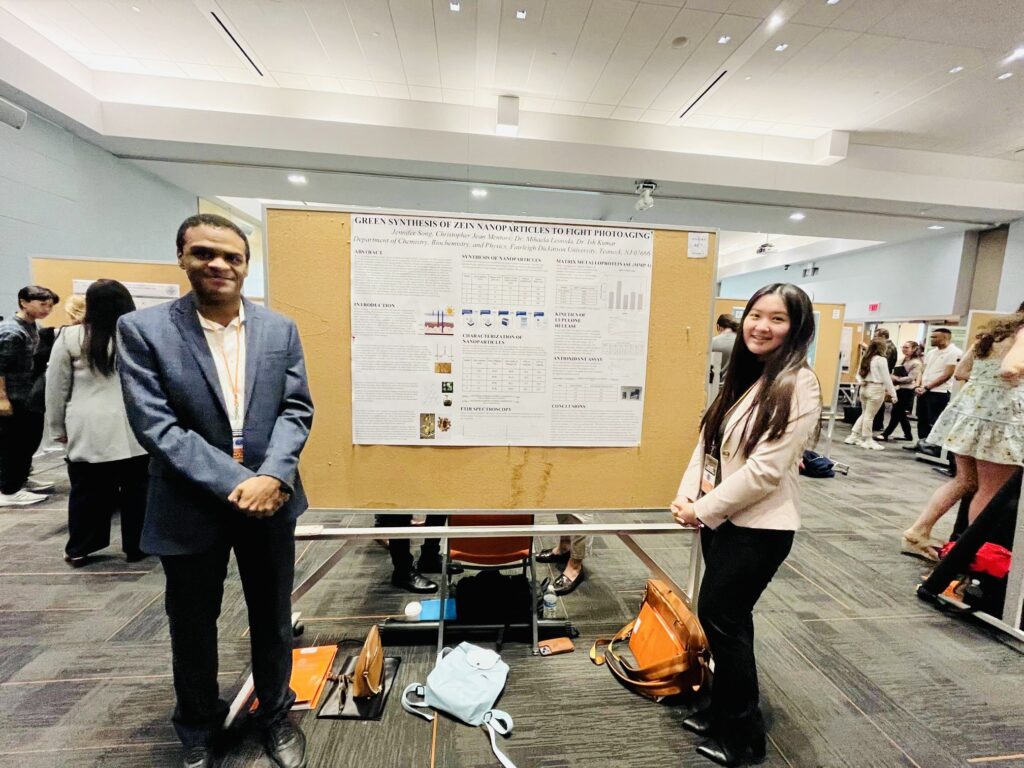 Christopher Jean and Jennifer Song presenting research on zein nanoparticles at the symposium.