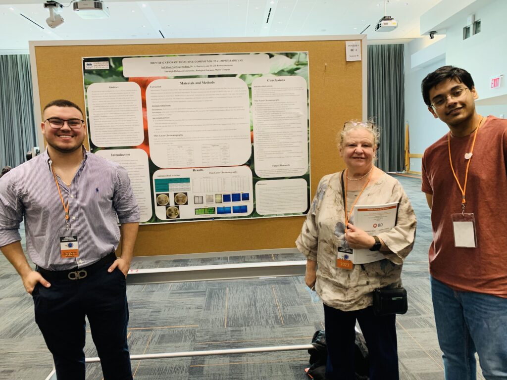 Saif Khan, Santiago Medina, and Alice Benzecry at the undergraduate research symposium.