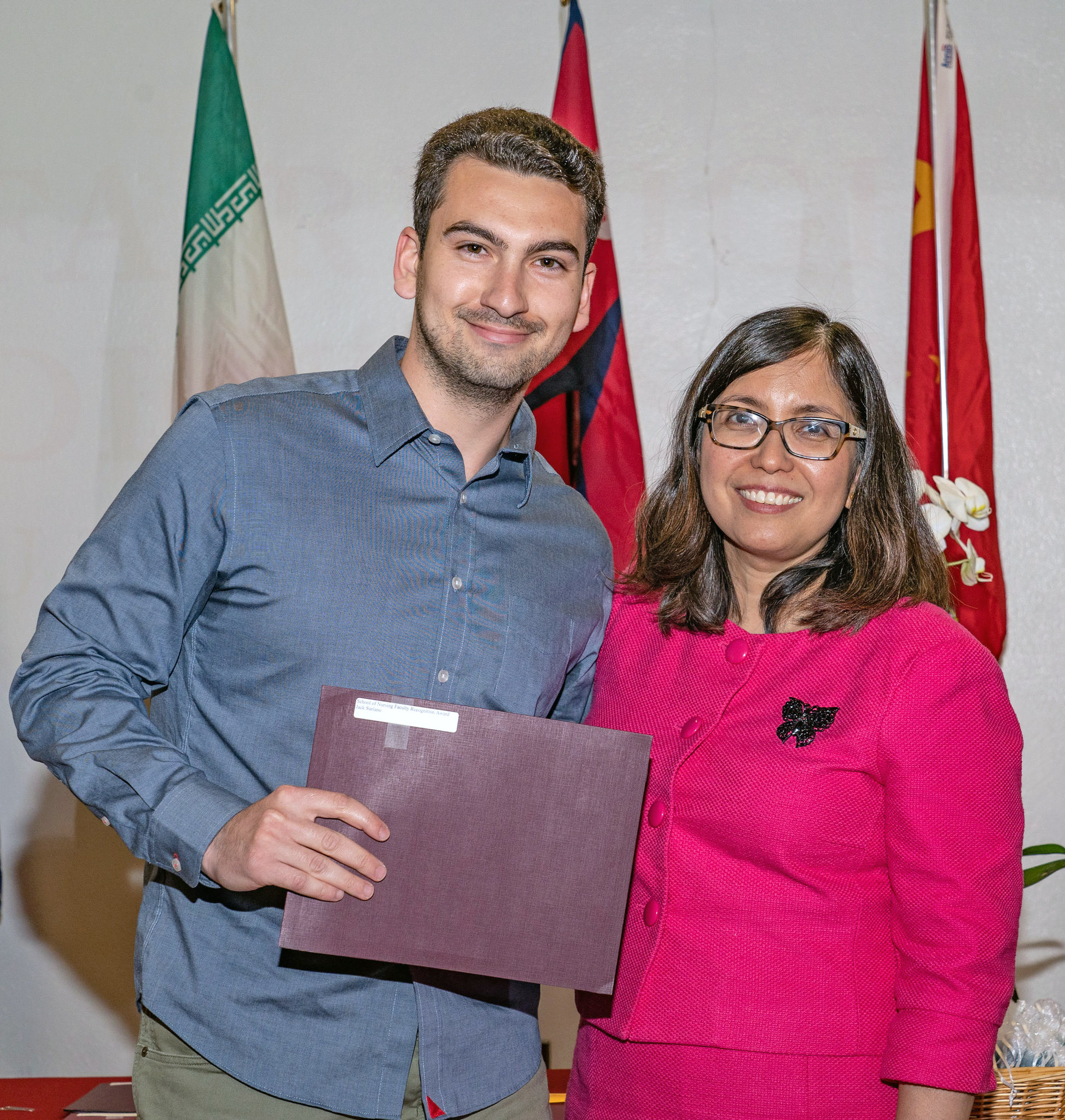 A man and a woman pose for a photo.