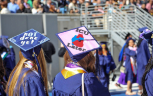 Decorated caps dot the crowd of graduates.