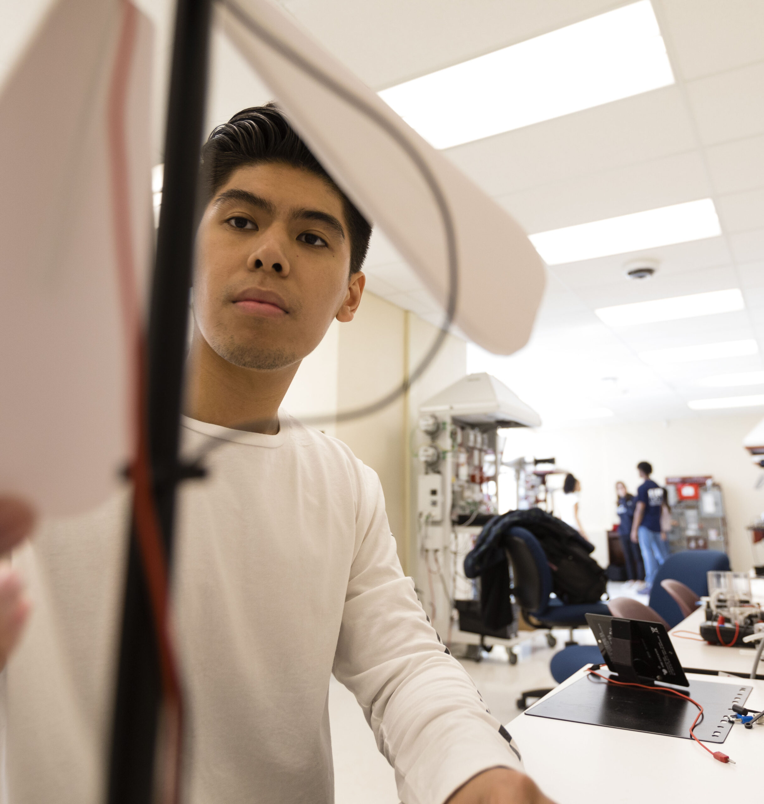 Student works with alternative energy sources in an engineering lab.