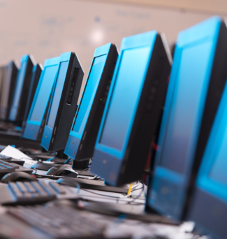 A bank of computers in a computer lab.