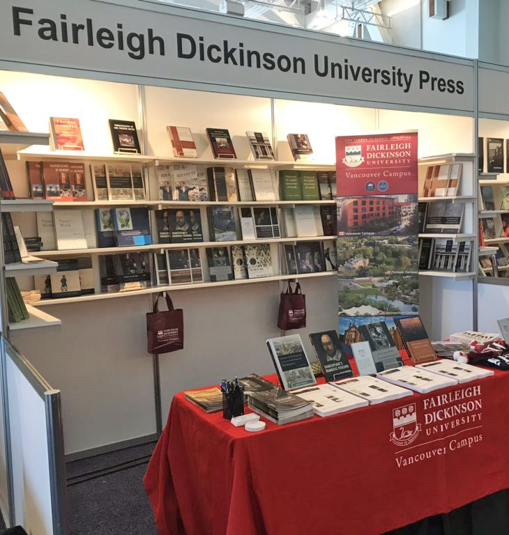 A booth and table featuring FDU Press publications.