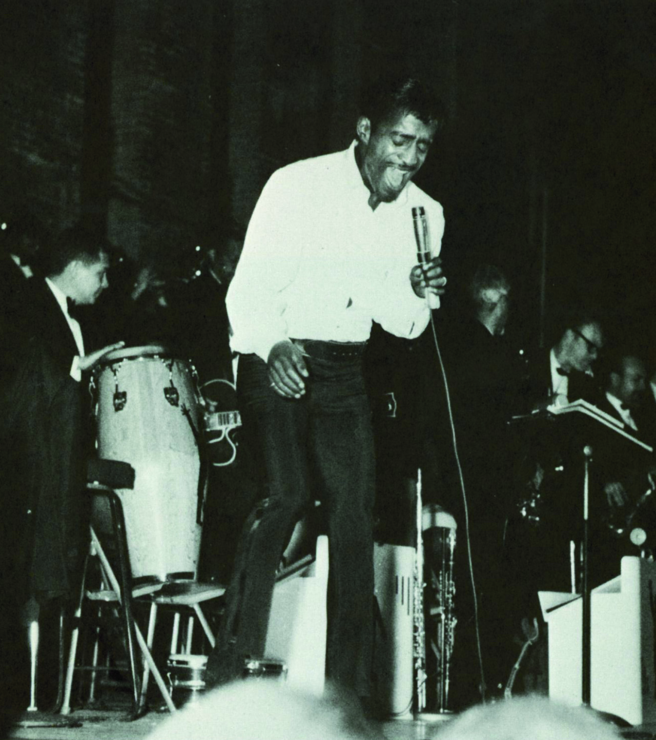 A singer performs. This is a vintage photo.