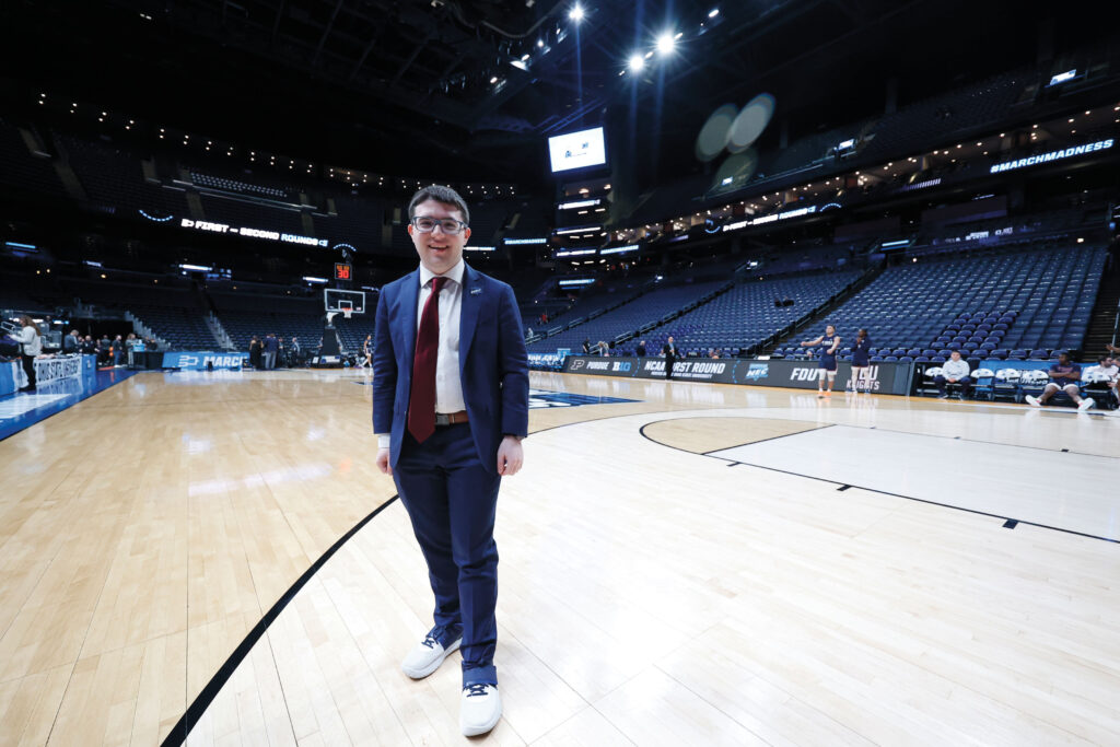 Jordan Sarnoff stands on a basketball court