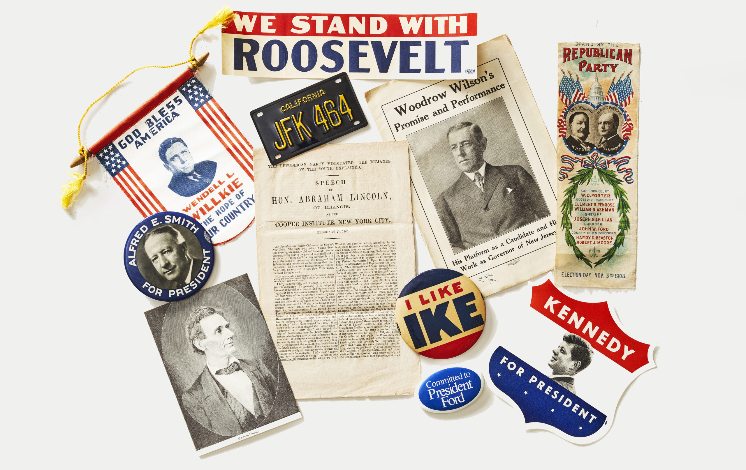 A collection of vintage campaign objects, including, buttons, pamphlets, photographs, a license plate and more.
