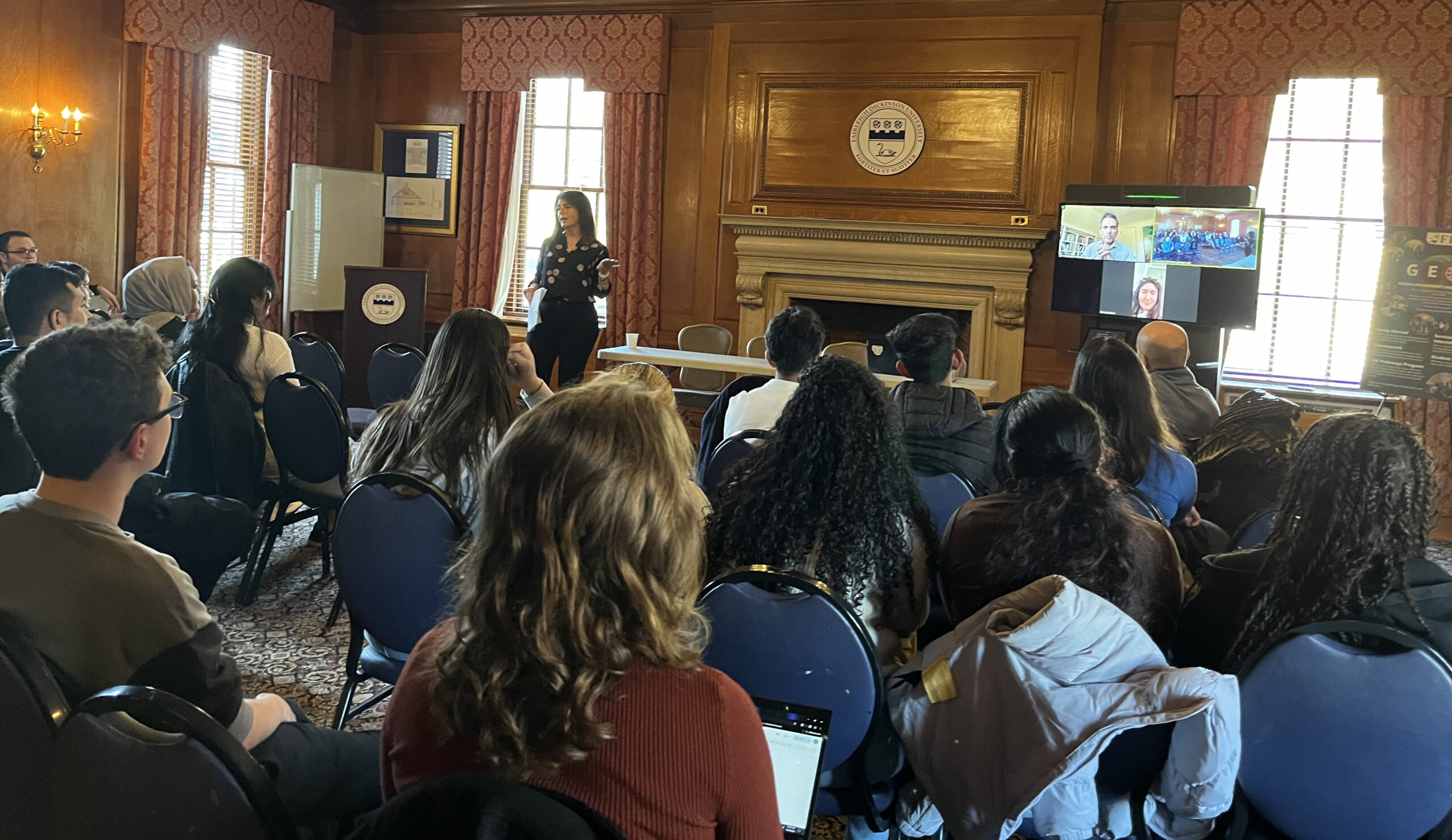 Students look on as a presenter speaks.