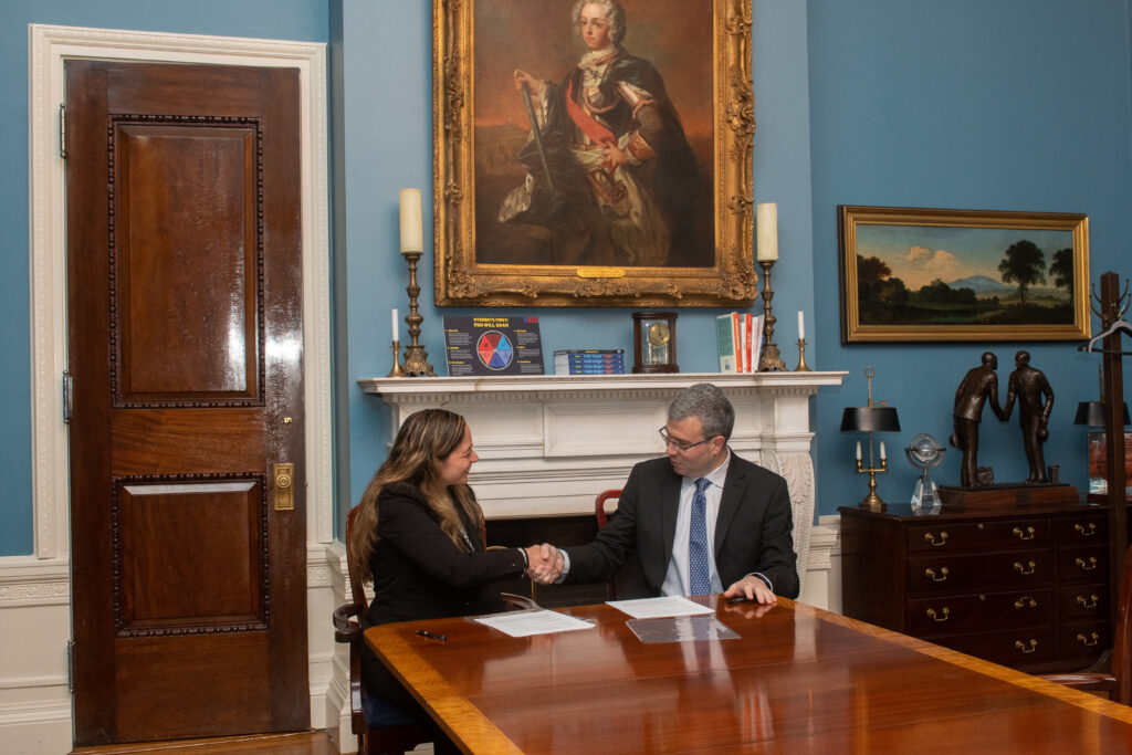 Two executives shake hands