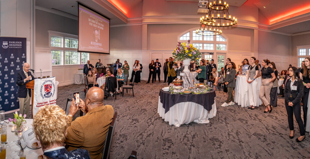 a ballroom and a man at the podium