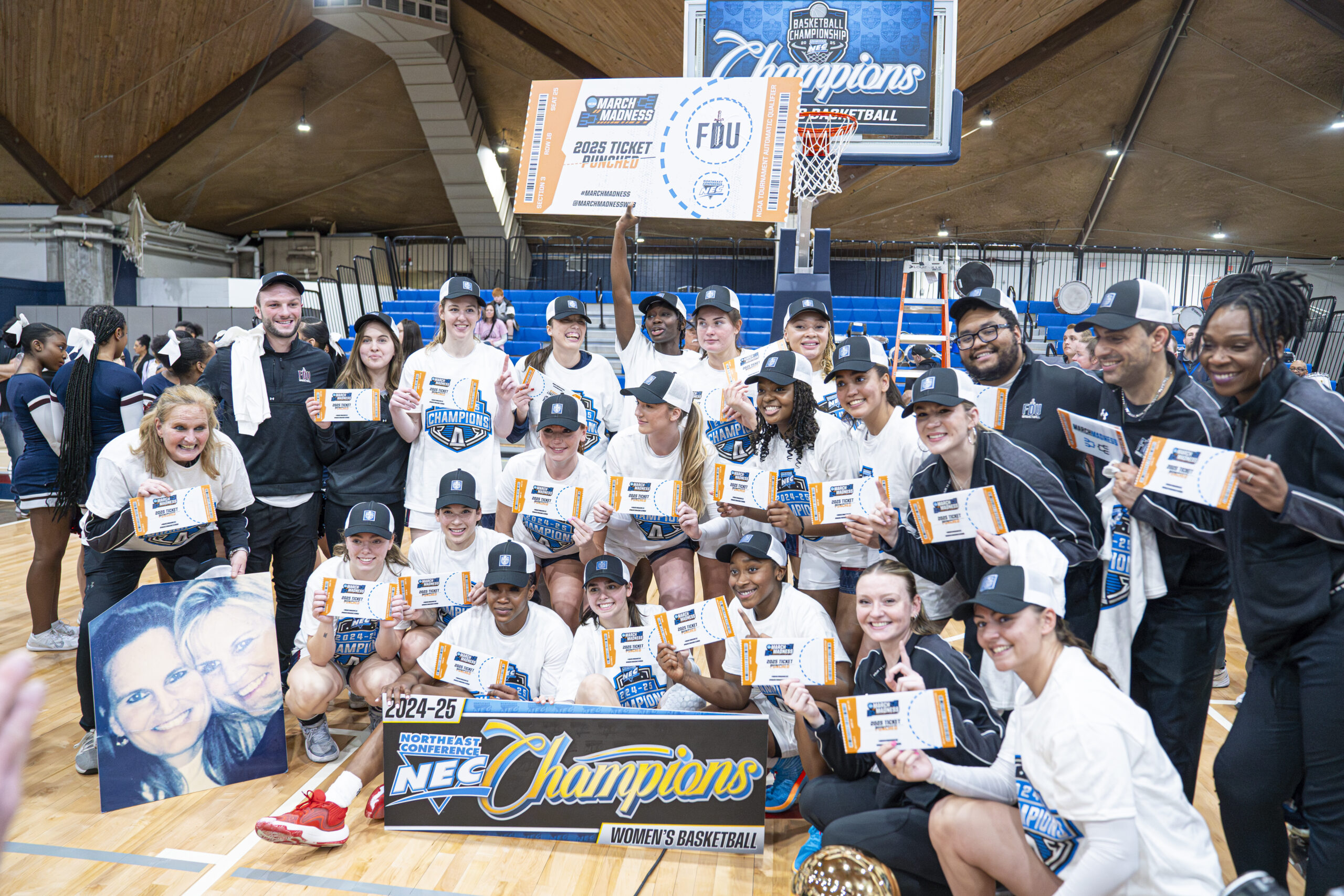 The FDU women's basketball team celebrates