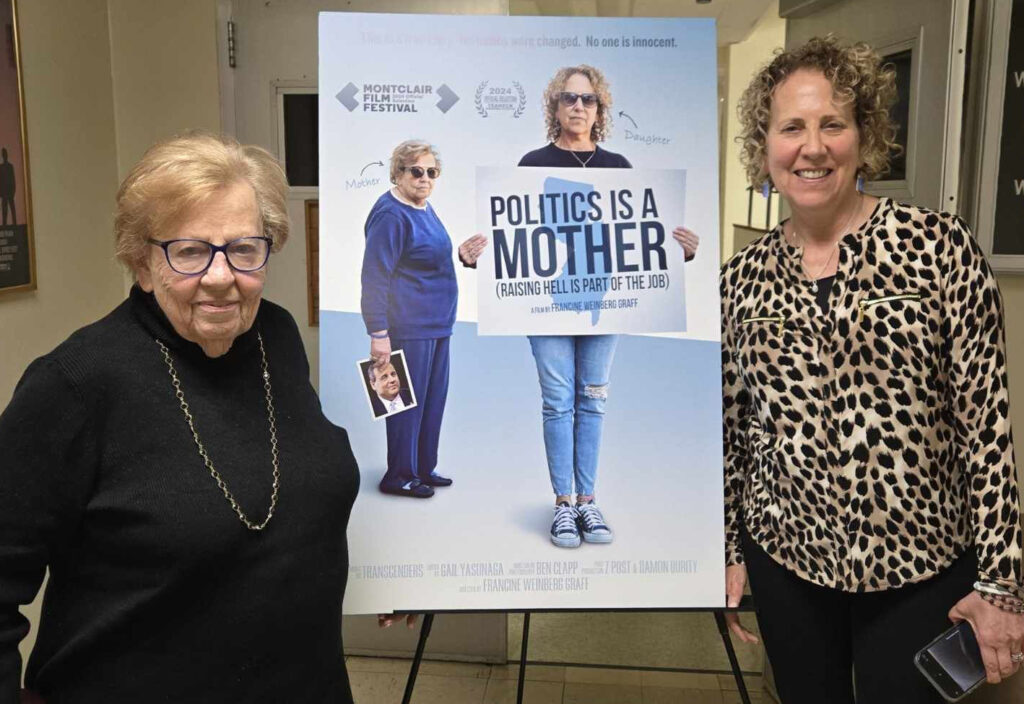 Senator Loretta Weinberg, left, and her daughter, Francine Graff, in front of movie poster