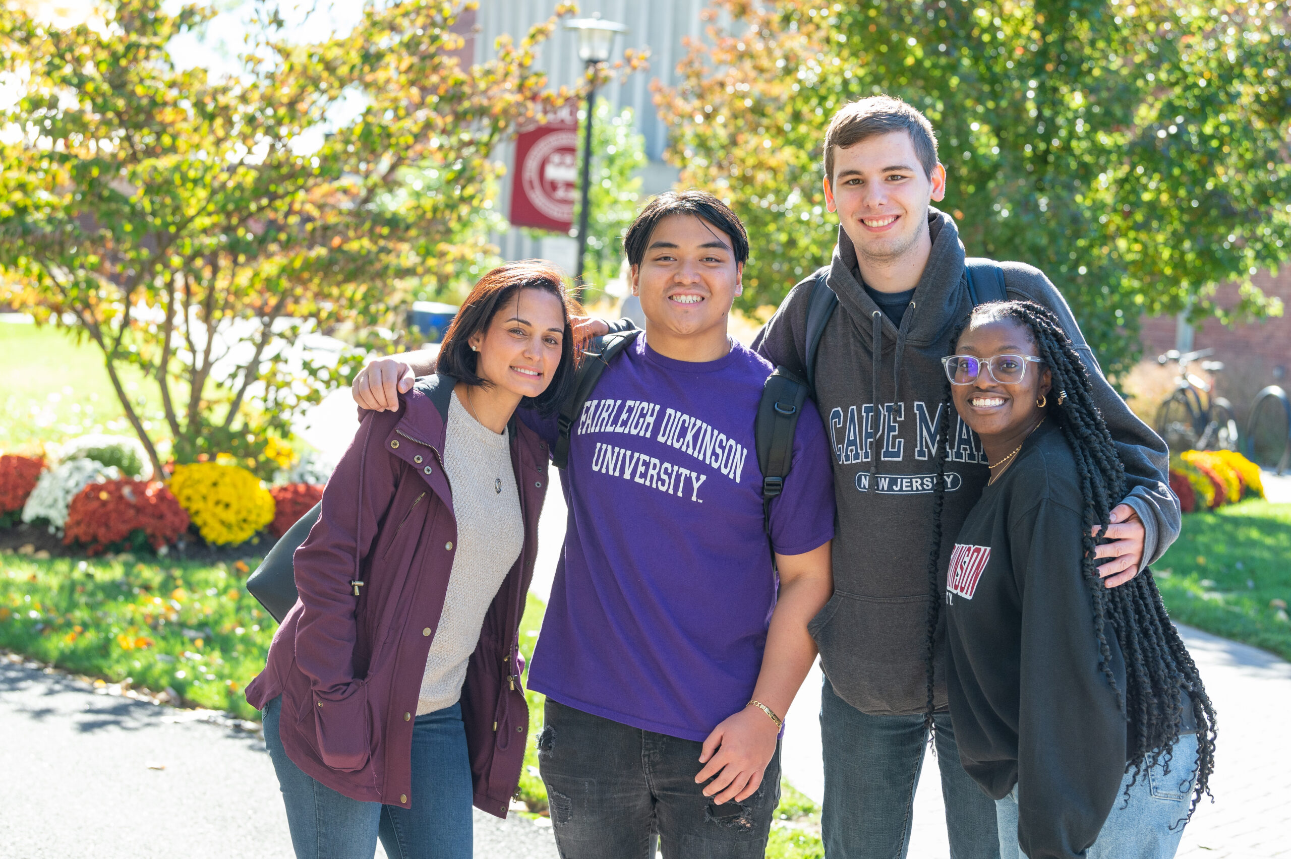 A group of four students posing for a camera