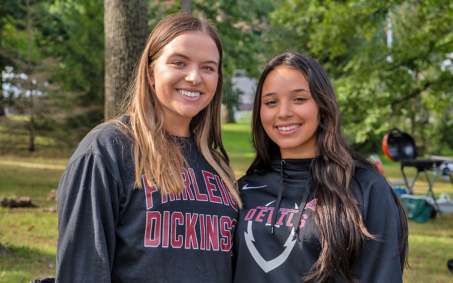 Two girls pose for a photo at Homecoming.