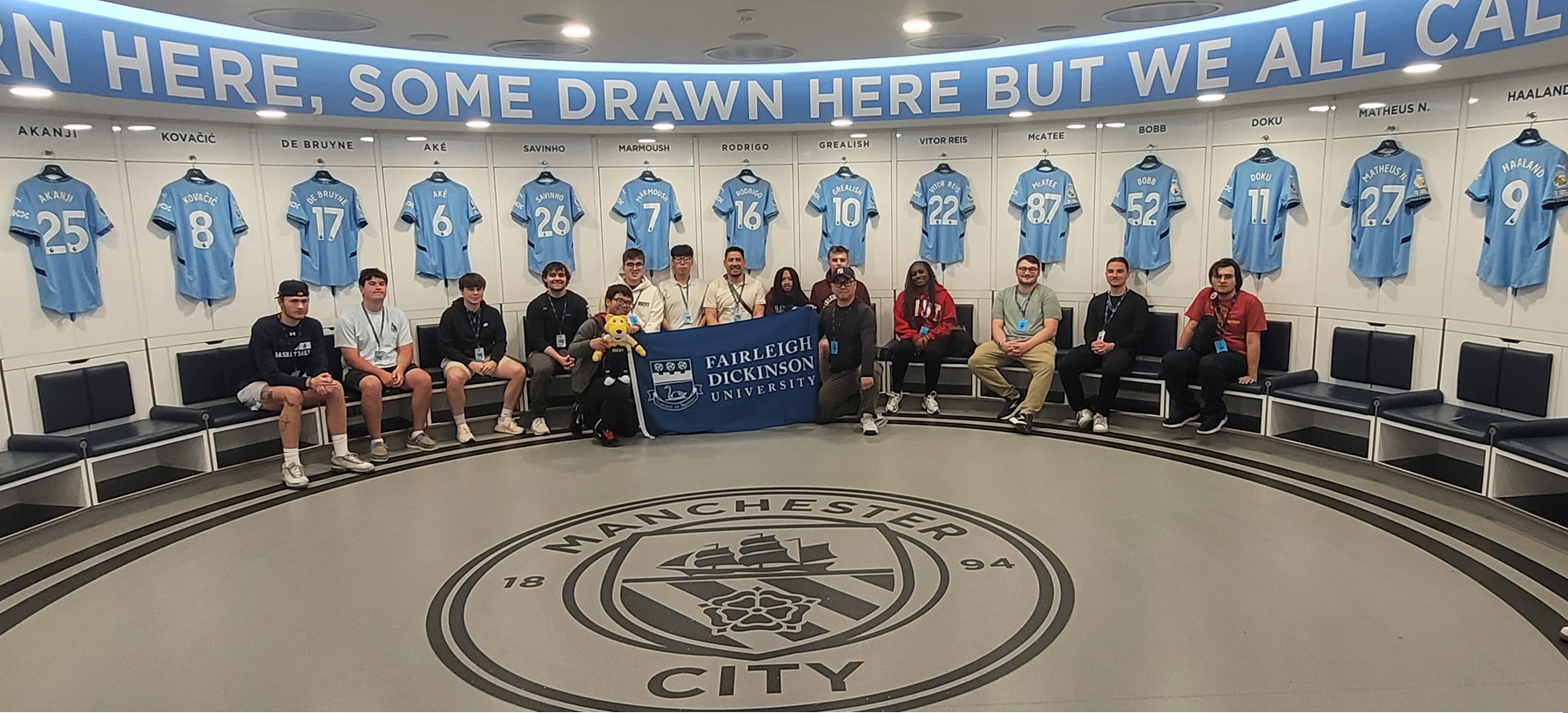 Group inside Manchester City Stadium changing room