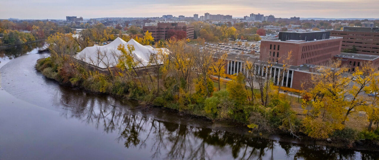 An aerial view of the Hackensack River and the Hackensack side of the Metropolitan Campus in autumn.