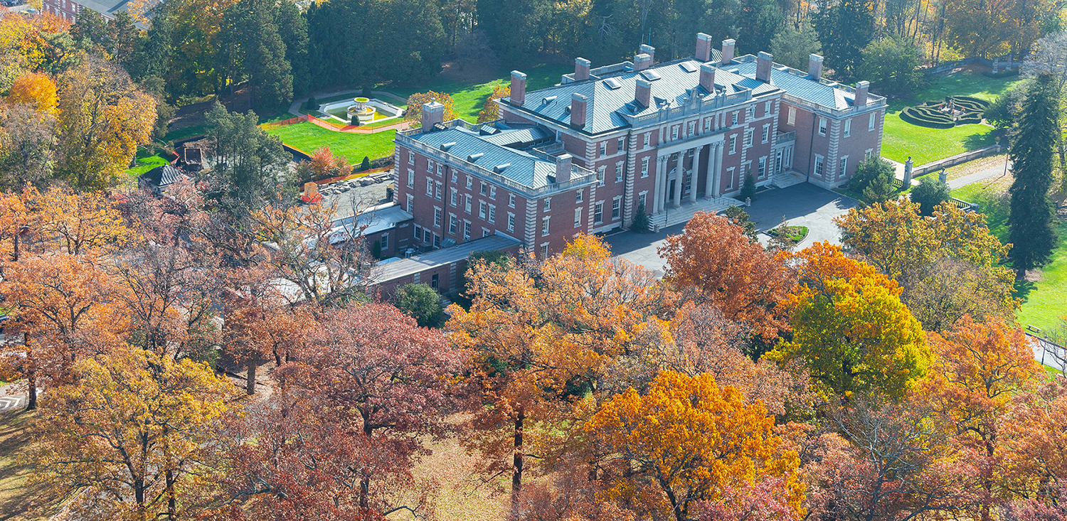 An aerial of Hennessy Hall on the Florham Campus, surrounded by trees with fall colors.