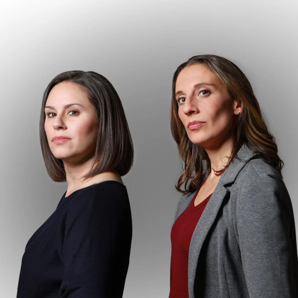 Two women pose for a photo.