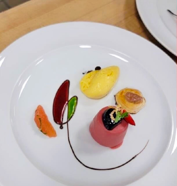 A plate of fine dining food.