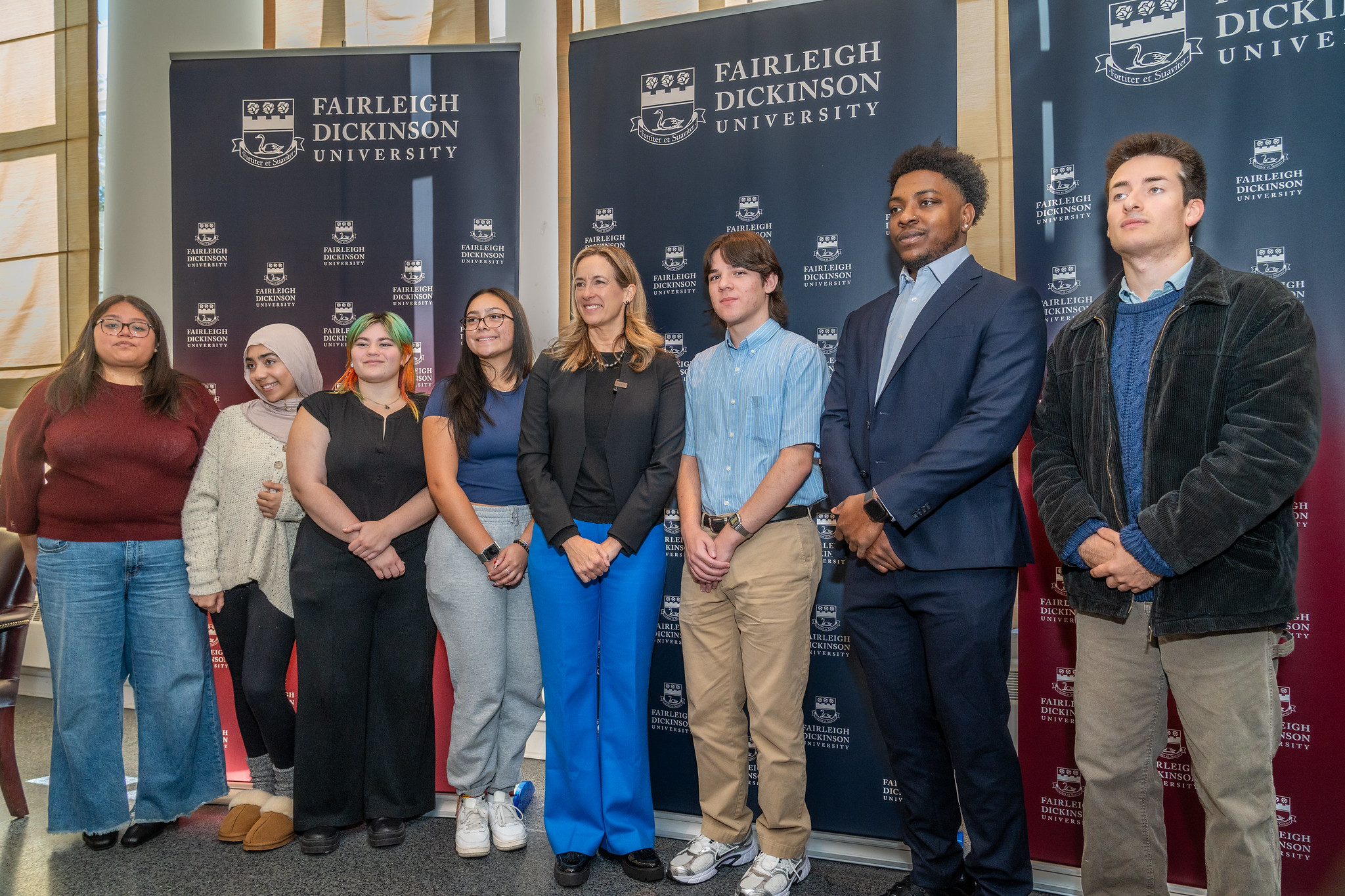 Governor-elect Mikie Sherrill poses and smiles with FDU college students.
