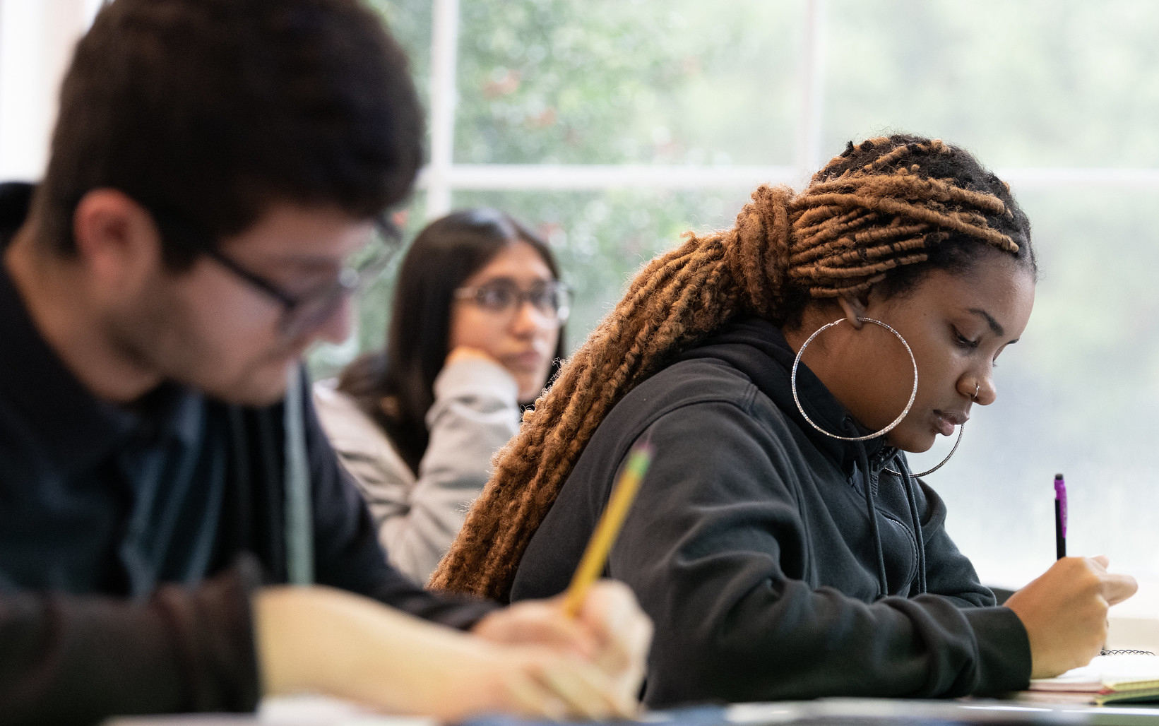 Students take notes in class.