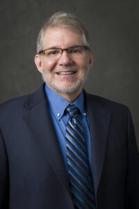 Smiling man in suit and tie