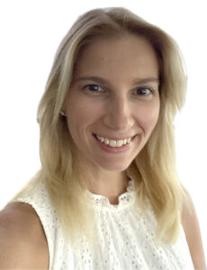 Close-up of smiling woman in white top