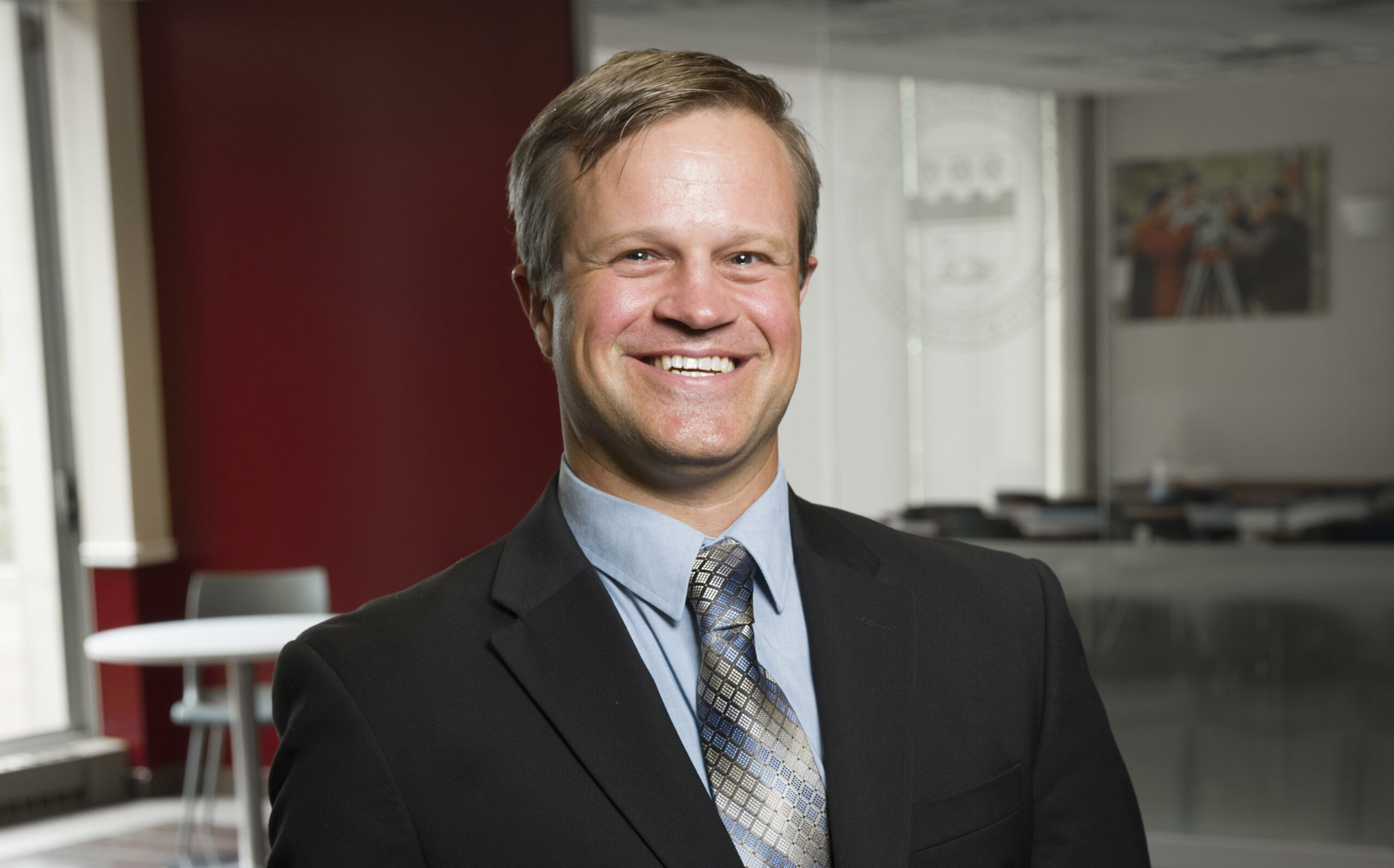 Portrait of a man in a suit.