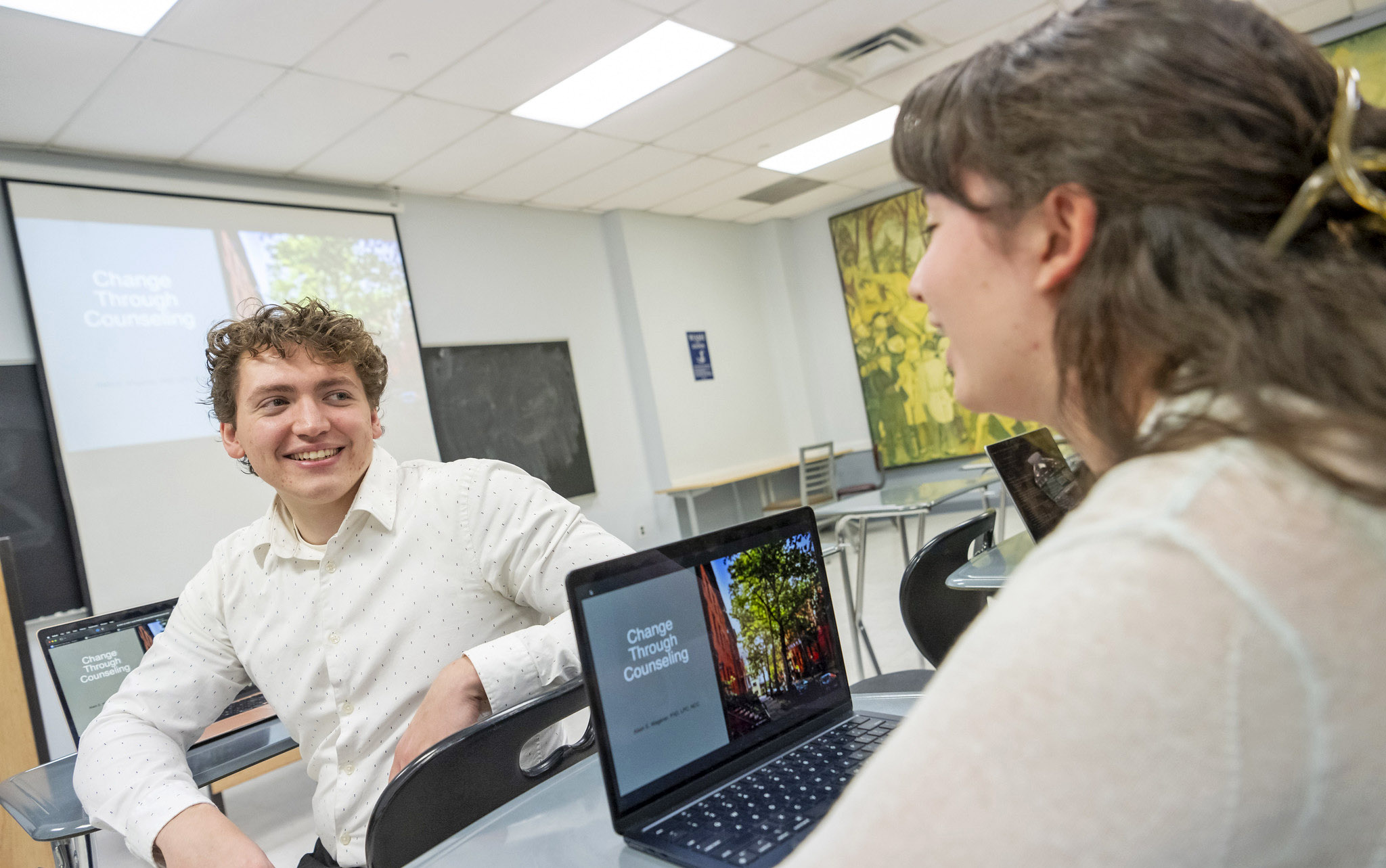 Two students chat in a psychology class.