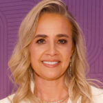 Photo of woman in white smiling