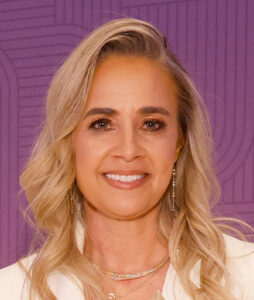 Photo of woman in white smiling