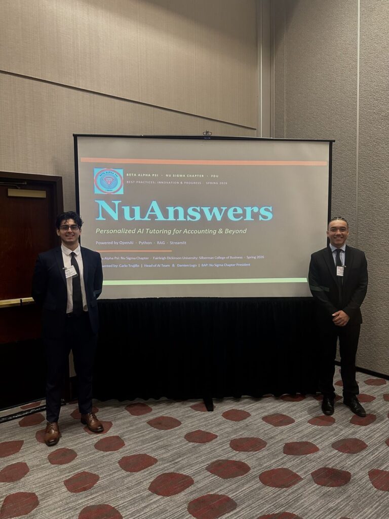 2 men stand in front of screen