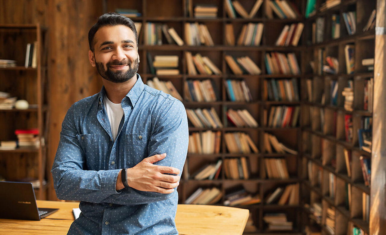 Man leaning on desk