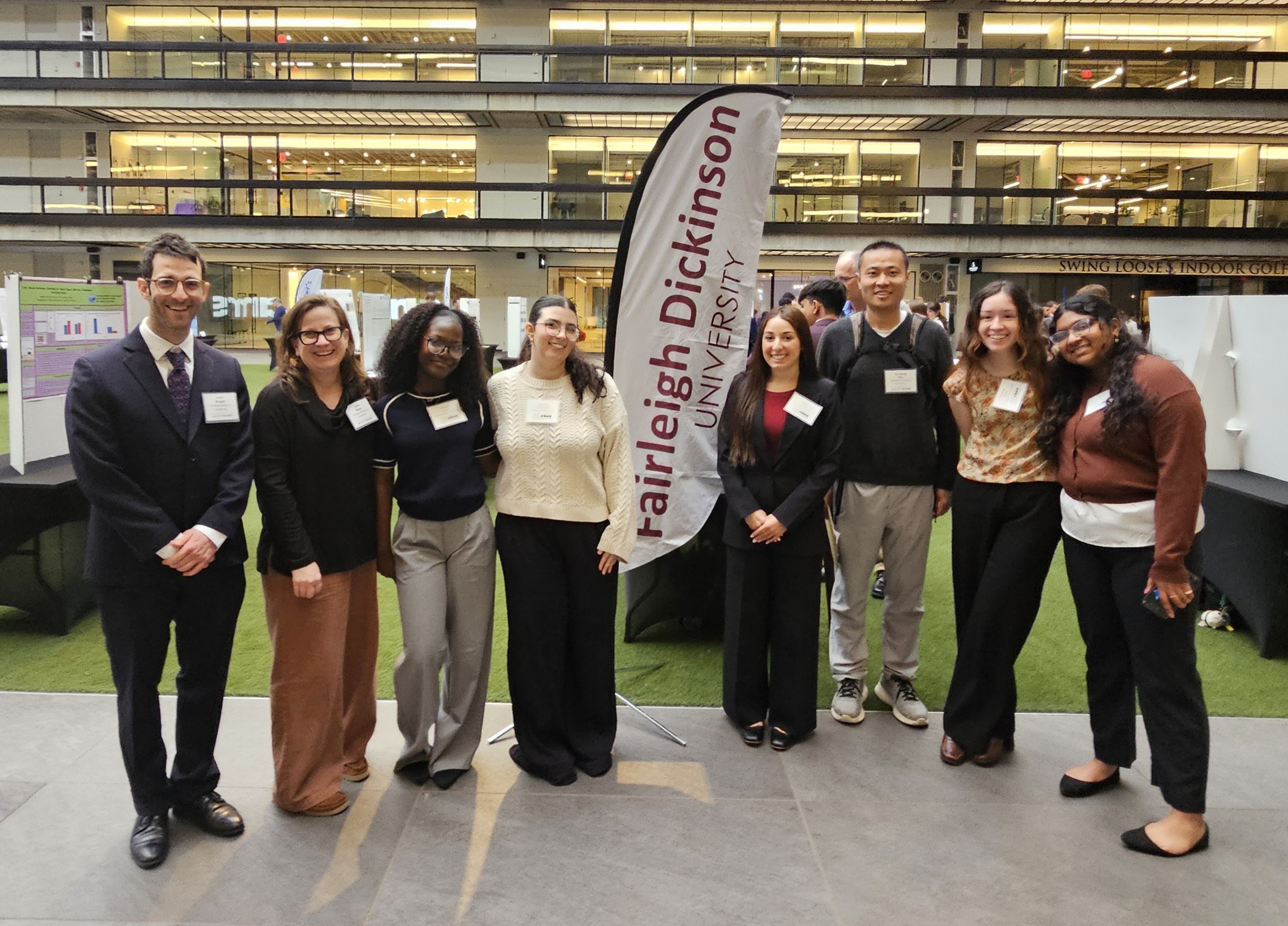 A group photos of members of the FDU community as the ICUNJ research symposium. 