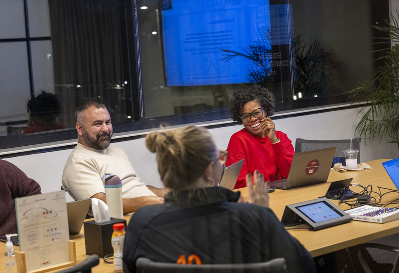 three people working