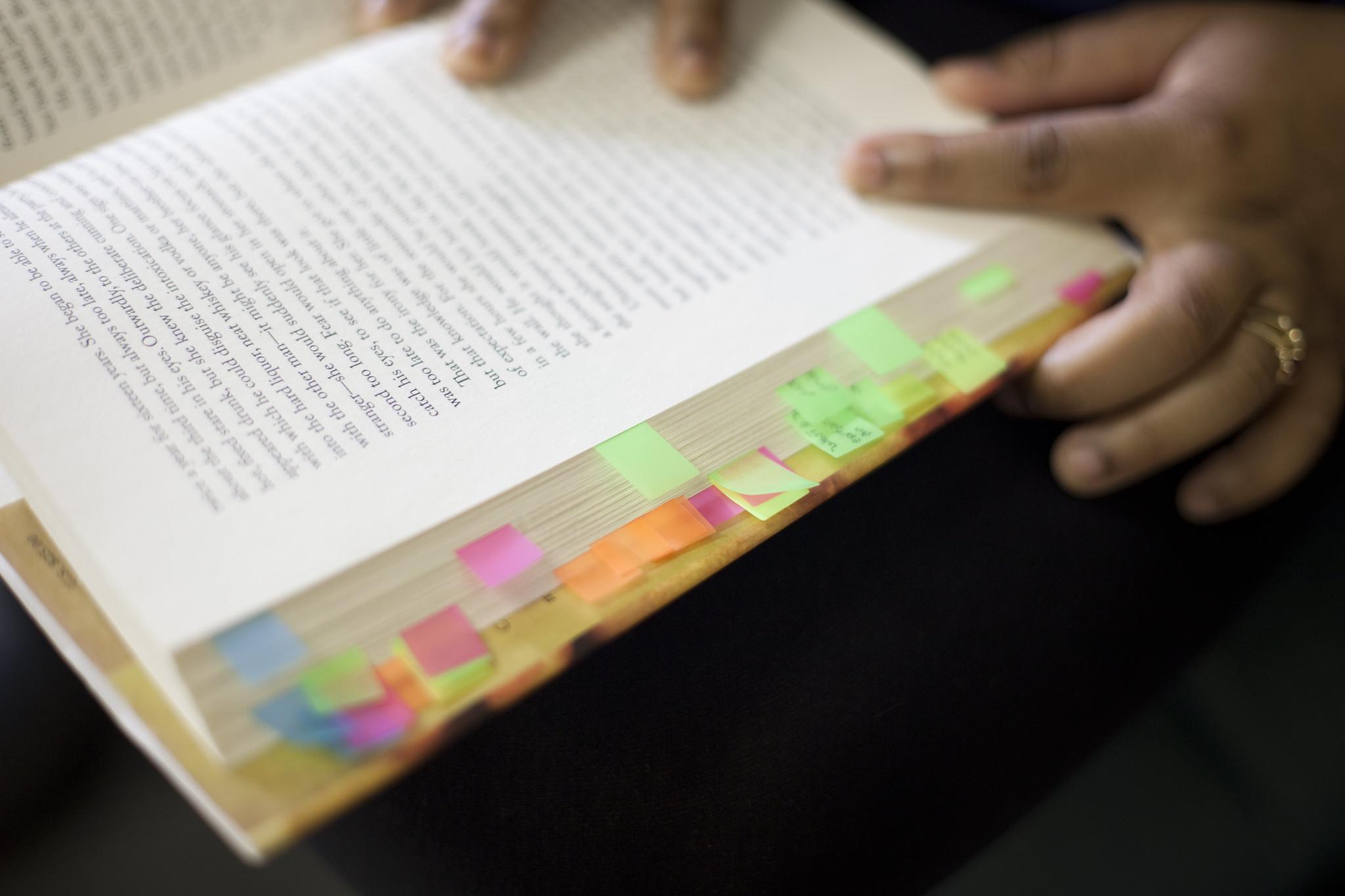 An open book with colorful tabs.