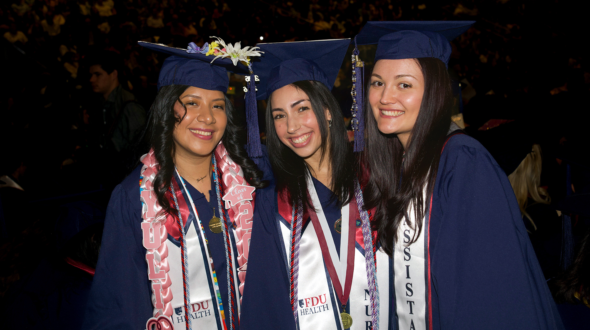 Smiling women at graduation.
