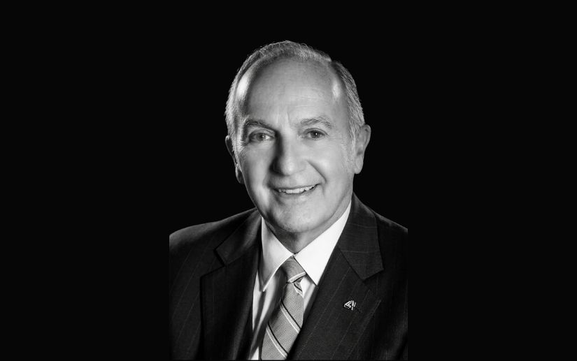 A black and white portrait of a man.