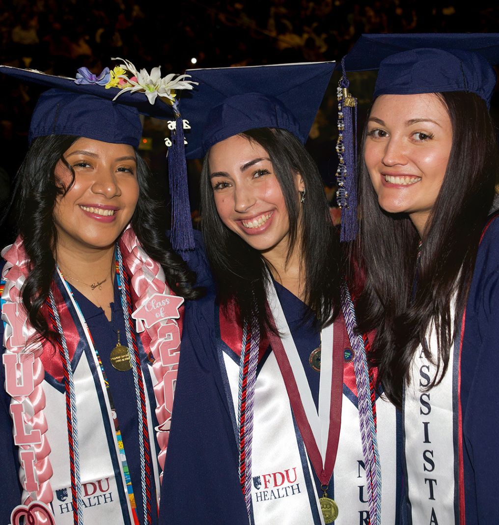 Smiling women at graduation.