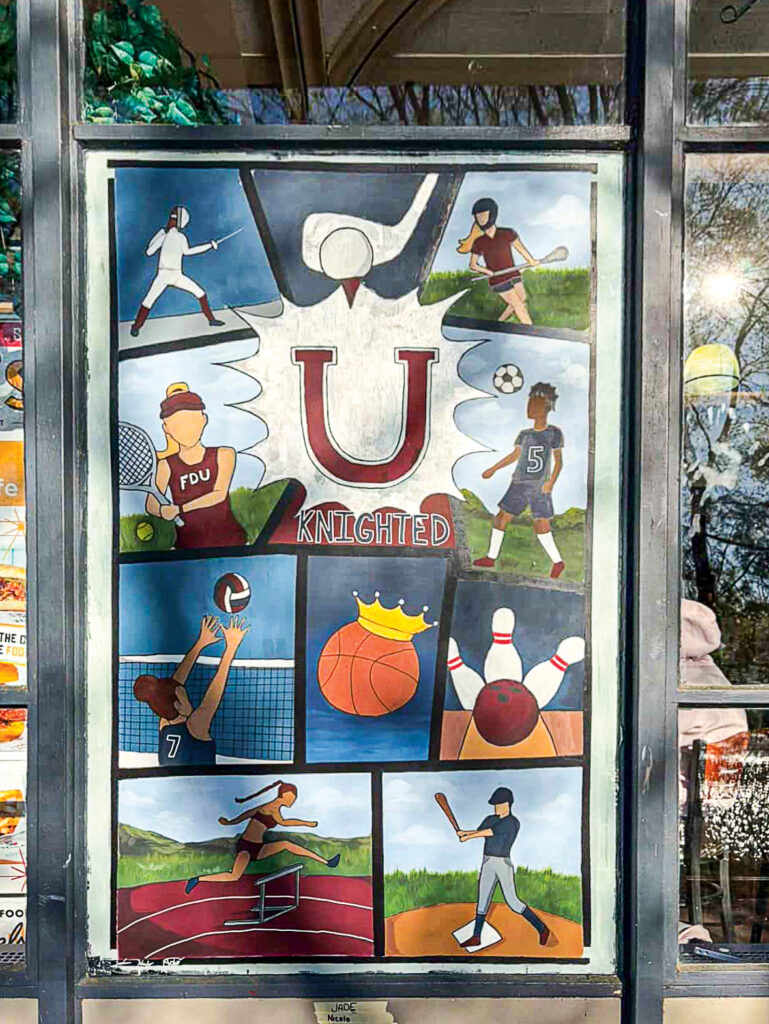 A painted window of athletics scenes.