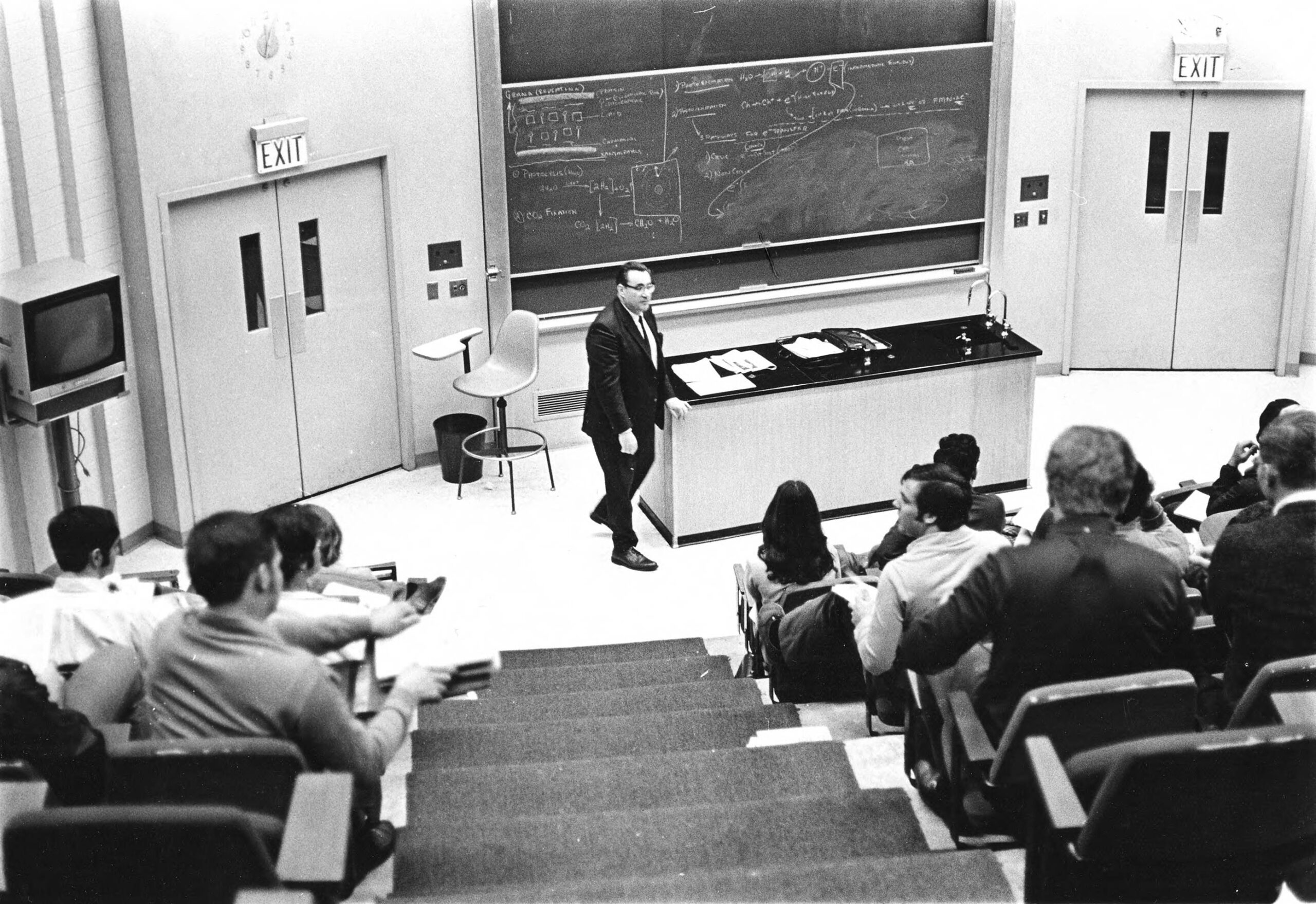 Professor gives a lecture to college students.